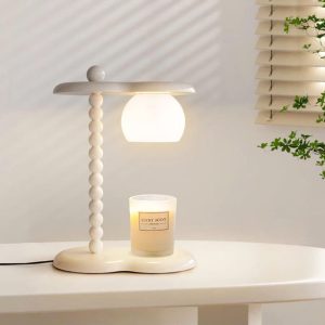 Nowoczesna lampa stołowa Everalda z podgrzewaczem świec