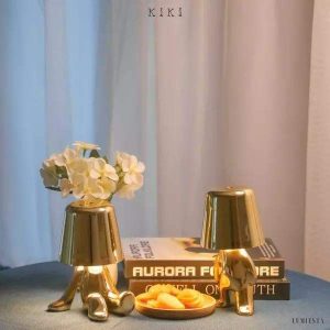 Innovative Thinker lamp shaped like a golden or chrome figure
