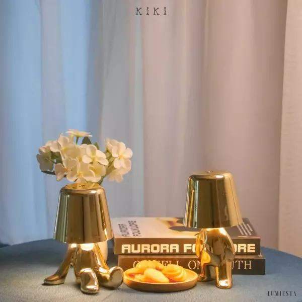 Innovative Thinker lamp shaped like a golden or chrome figure