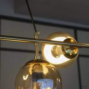 Lampa wisząca Orb w stylu industrialnym z kulistymi kloszami