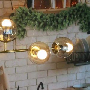 Lampa wisząca Orb w stylu industrialnym z kulistymi kloszami