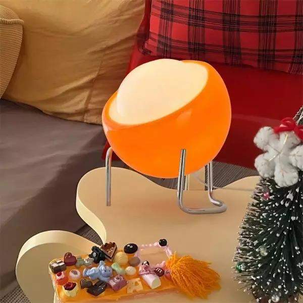 Lampa stołowa pomarańczowa szklana kulista, detale podstawy i mocowania
