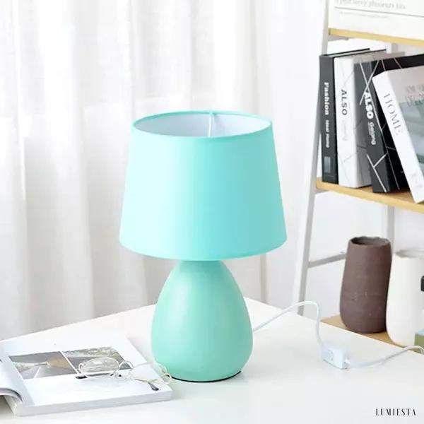 Nowoczesna ceramiczna lampa stołowa, zbliżenie na połączenie klosza i podstawy