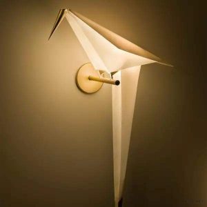 Perch wall lamp in the shape of an origami bird