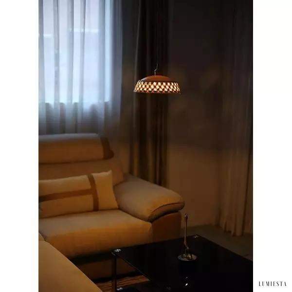 Openwork ceramic lamp with a hand-carved shade