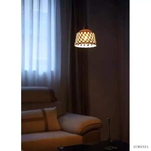 Openwork ceramic lamp with a hand-carved shade