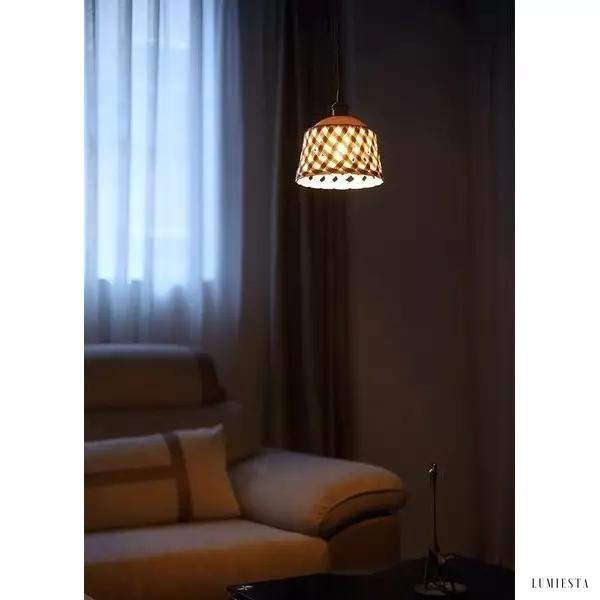 Openwork ceramic lamp with a hand-carved shade
