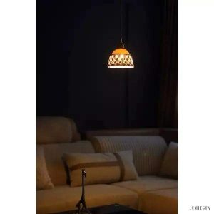 Openwork ceramic lamp with a hand-carved shade