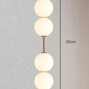 Nowoczesna lampa wisząca z podwójnym okrągłym kloszem - detal złotej oprawy