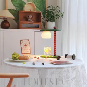 Nowoczesna lampa stołowa Everalda z podgrzewaczem świec