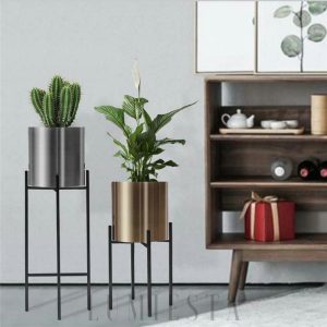 Elegancki metalowy stojak na doniczkę w nowoczesnym stylu - złoty stojak na doniczkę z geometryczną podstawą
