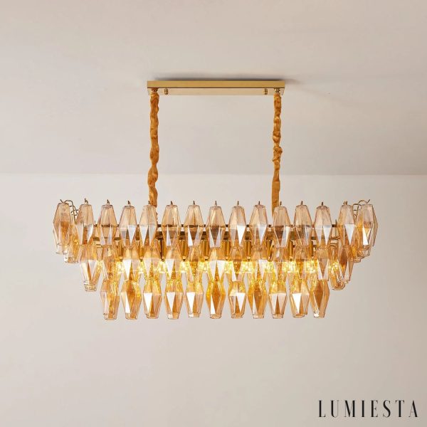 Cometa - całość lampy wiszącej z metalem i bursztynowym szkłem w eleganckiej formie