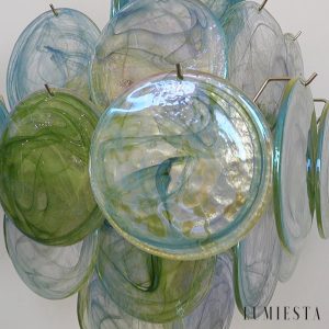 Fascino - nowoczesna lampa wisząca z zielonego szkła i metalu nad stołem