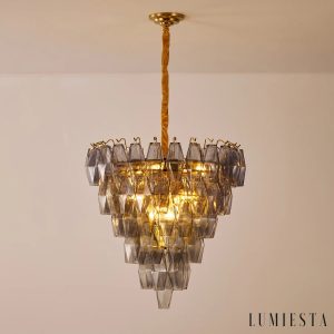 Lusso - dymnoszare szkło w świetle na złotej oprawie