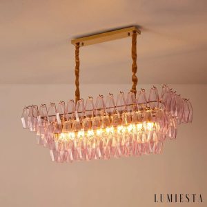 Stile - szklana lampa wisząca z różowymi kloszami nad stołem