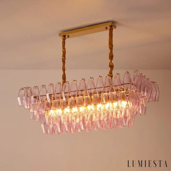 Stile - szklana lampa wisząca z różowymi kloszami nad stołem