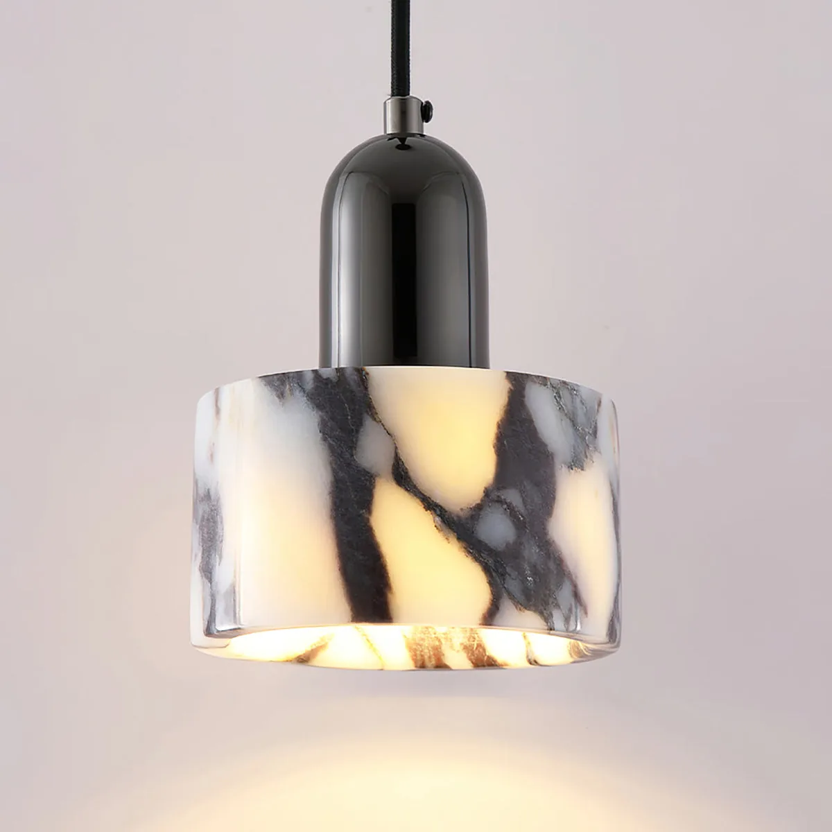 Windessa marble pendant: translucent marble cylinder with dark veins