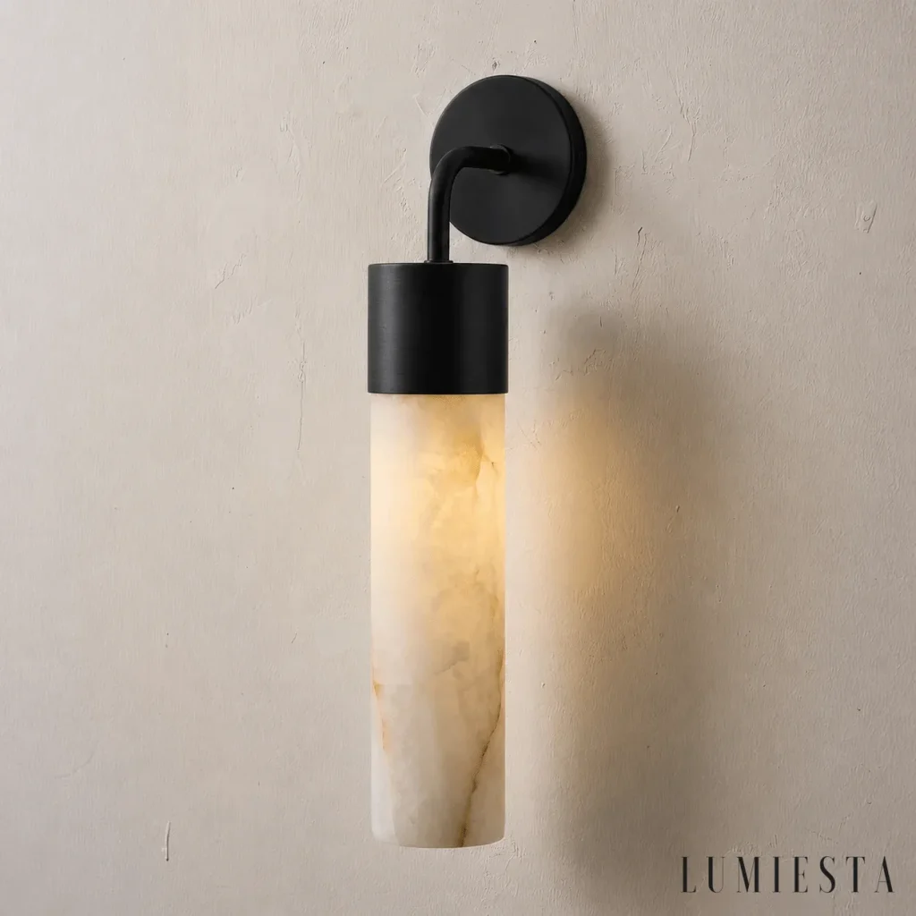 Denia - tubular alabaster wall light - with the light switched on